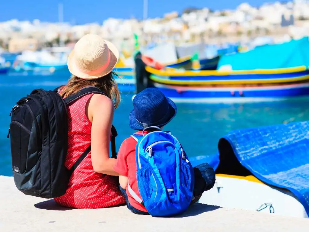 mother and son looking at boats in Malta